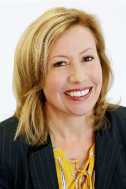 A person smiling for the camera

Description automatically generated